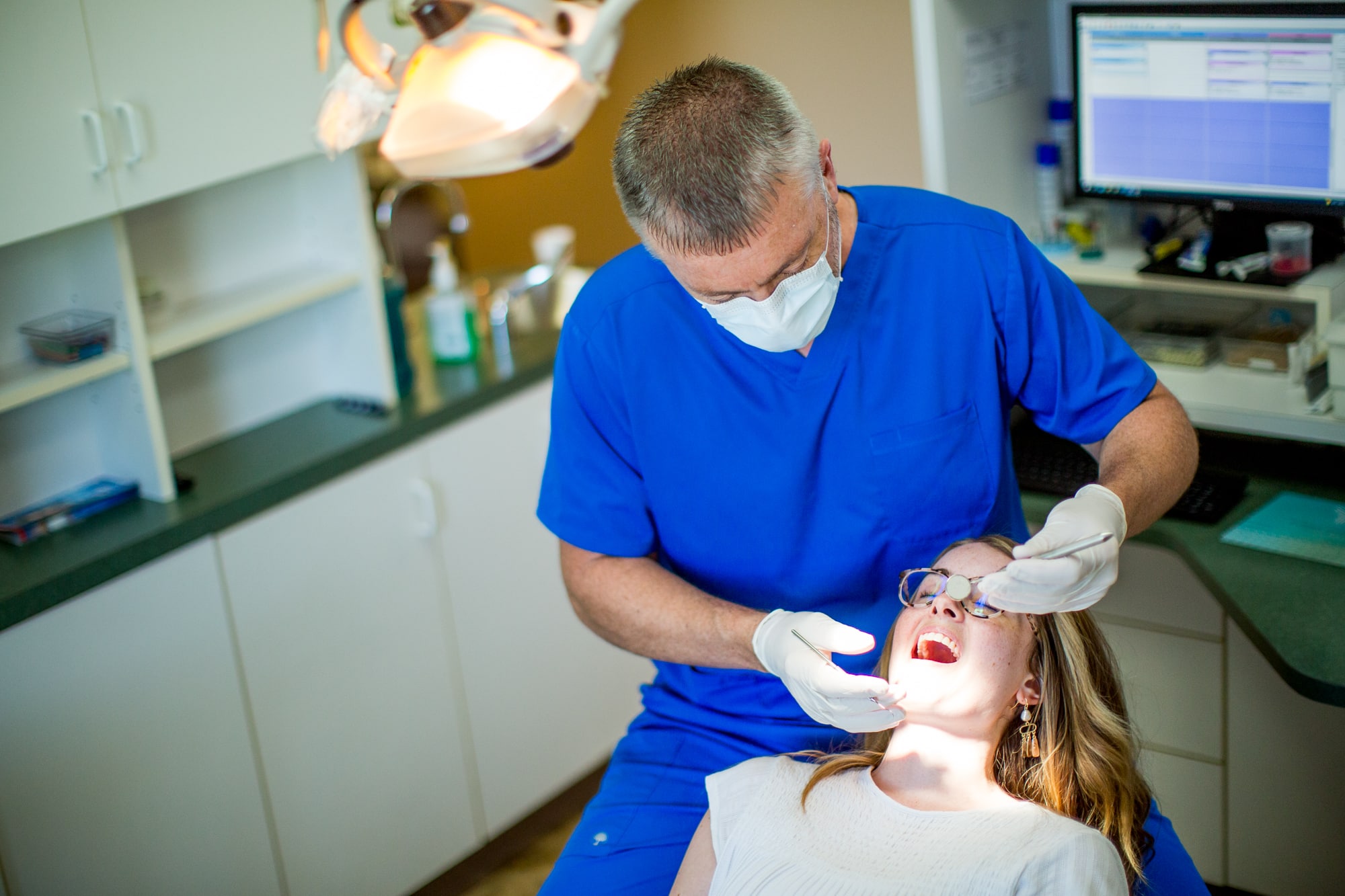 Staff member smiling with patient